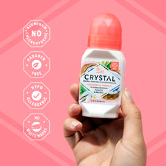 Applying Crystal Essence Coconut Vanilla roll-on delivers quick-dry protection on skin.