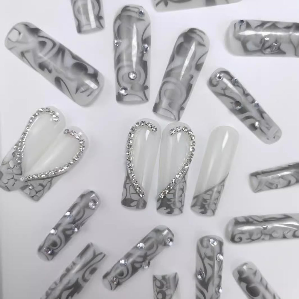 CTTHNBD silver French-tip nails with heart design for chic party or date-night manicure