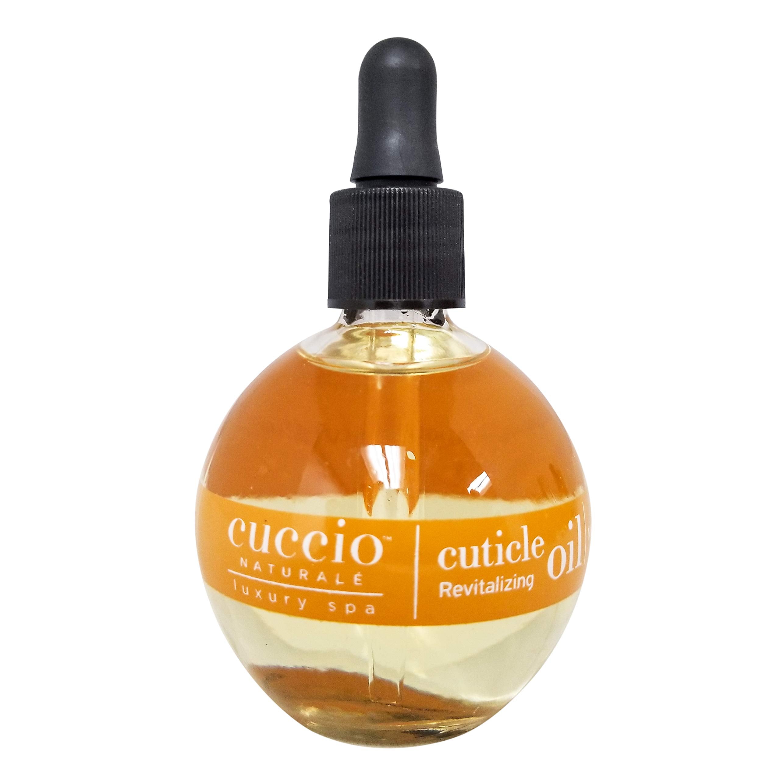 Cuccio Revitalize Cuticle Oil droplets on skin indicate rich hydration.