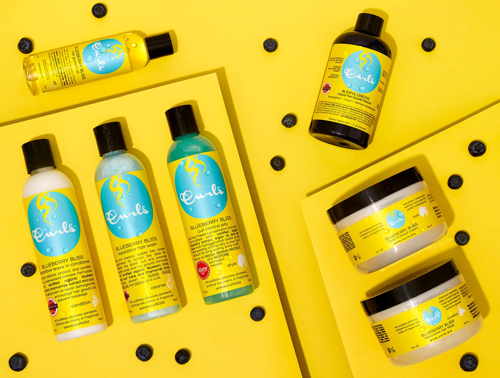 Curls Blueberry Bliss collection branding on vibrant packaging.
