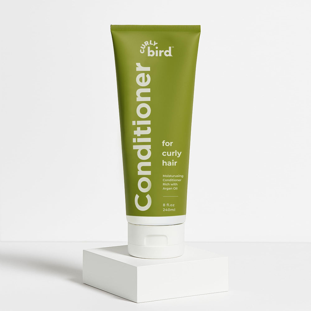 Curly Bird Deep Curl Conditioner packaging highlights easy-use bottle for quick application.