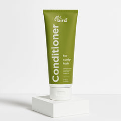 Curly Bird Deep Curl Conditioner packaging highlights easy-use bottle for quick application.