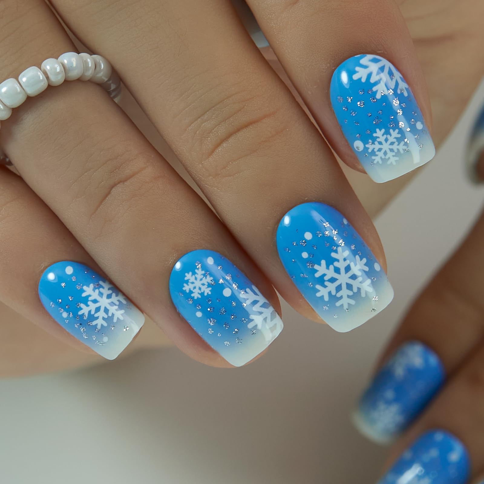 CurvLife blue ombre snowflakes nails, chic look for parties and events.