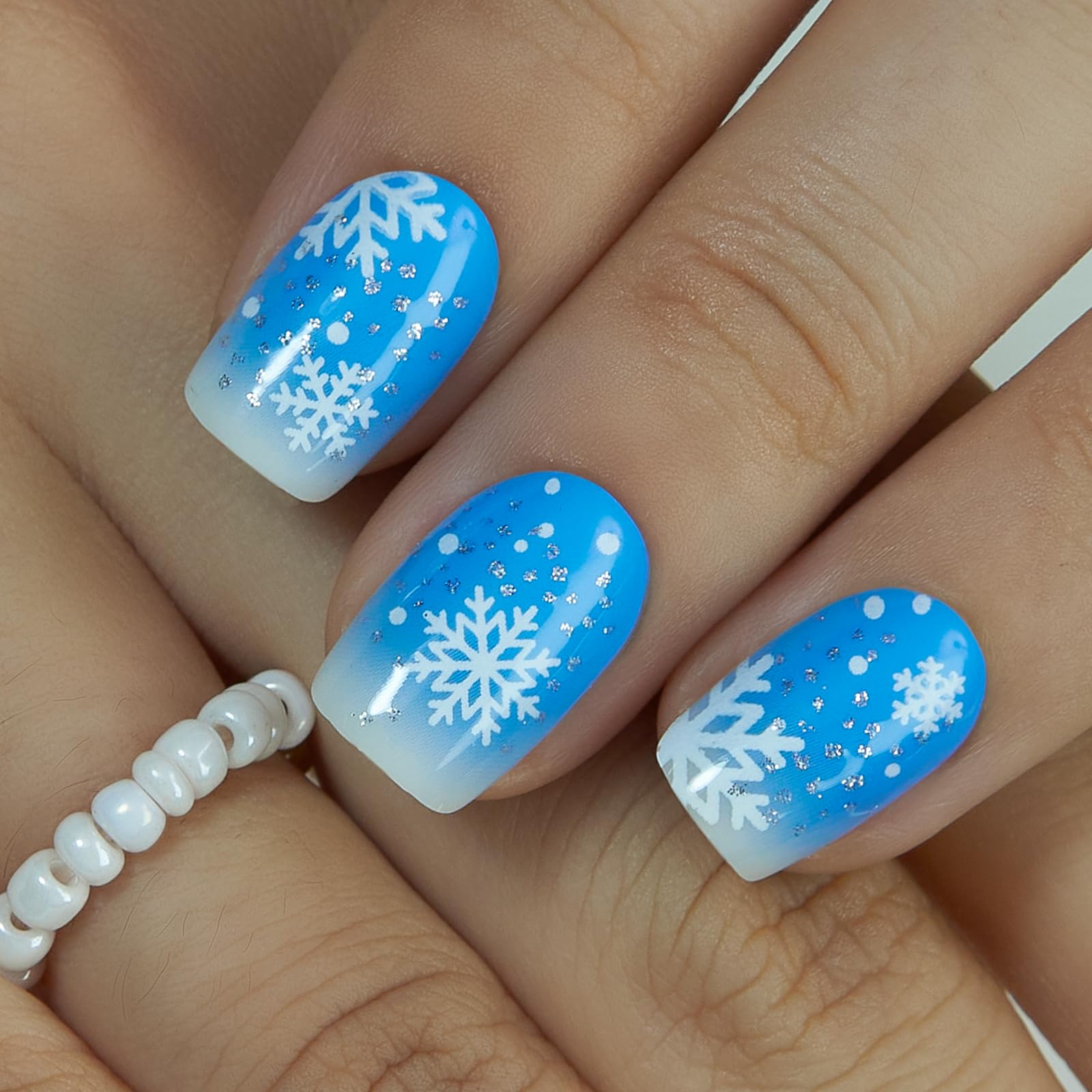CurvLife blue ombre nails with snowflakes, ready for daily wear.