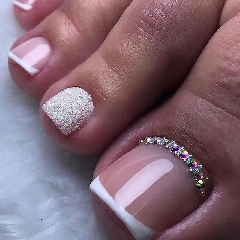 CurvLife glossy white French-tip press-on toenails with rhinestones for a quick at-home pedicure
