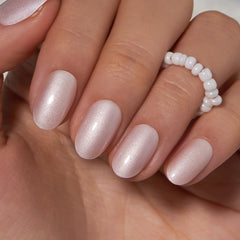 Curvlife Moonlight Pearly Shimmer press-on nails with a gel layer for long-lasting shine.