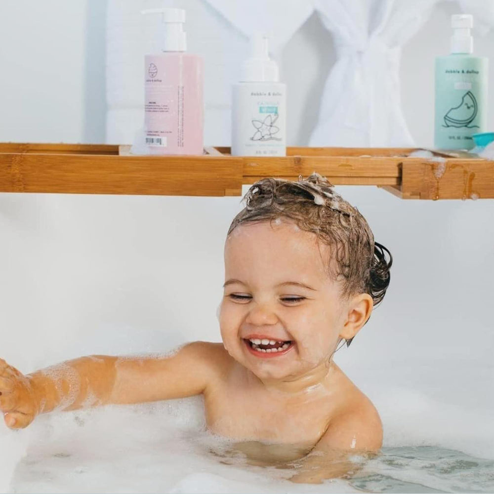 Dabble & Dollop Beachy Bundle body wash bottle displayed for smooth skin during bath.