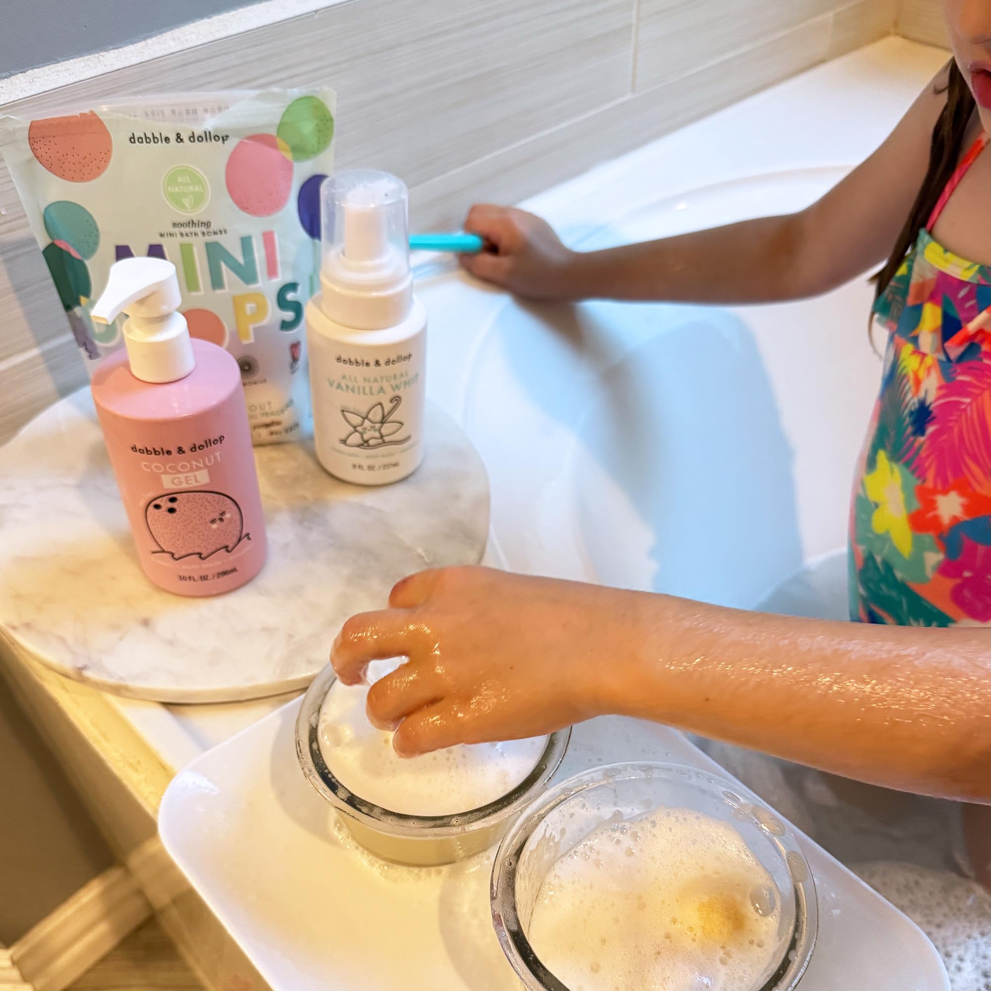Dabble & Dollop rose scent droplet for delicate bath moments.