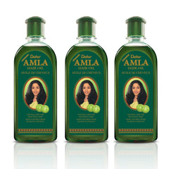Dabur Amla Hair Oil bottle being poured to suggest easy application and convenience.