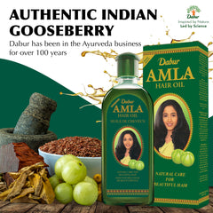 Dabur Amla Hair Oil label close-up featuring pure amla and botanical extracts.