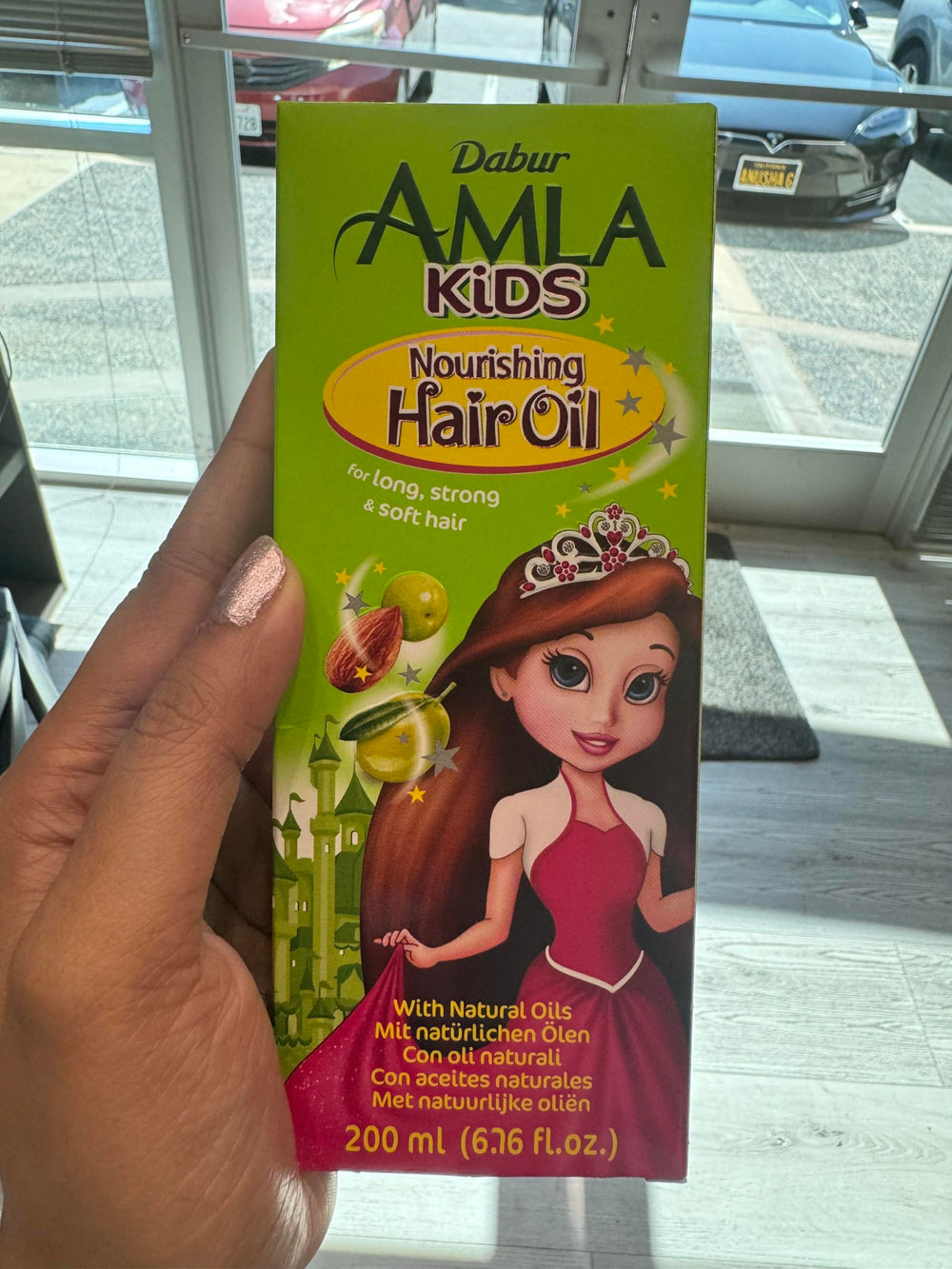 Dabur Hair Nourishing Oil for Kids ingredients with amla, olive, and almond nourish scalp
