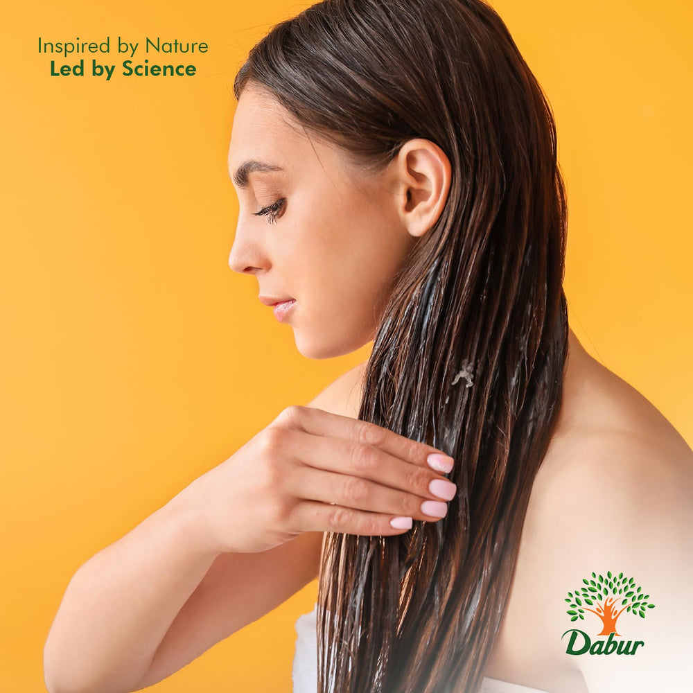 Dabur Maha Bhringraj Hair Oil texture close-up with non-greasy feel.