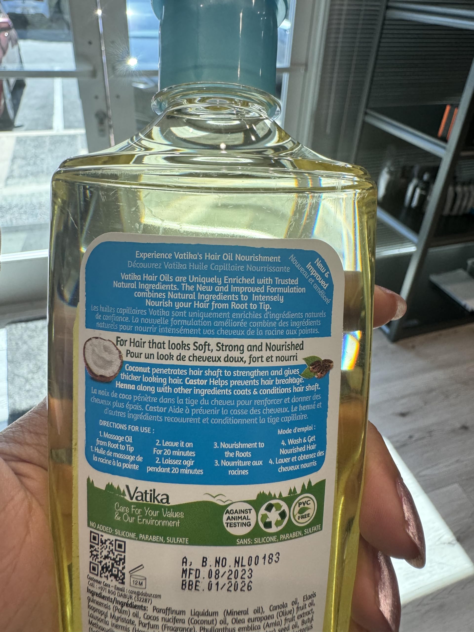 Dabur Vatika Enriched Coconut Hair Oil application to hands for scalp massage