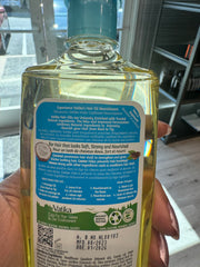 Dabur Vatika Enriched Coconut Hair Oil application to hands for scalp massage