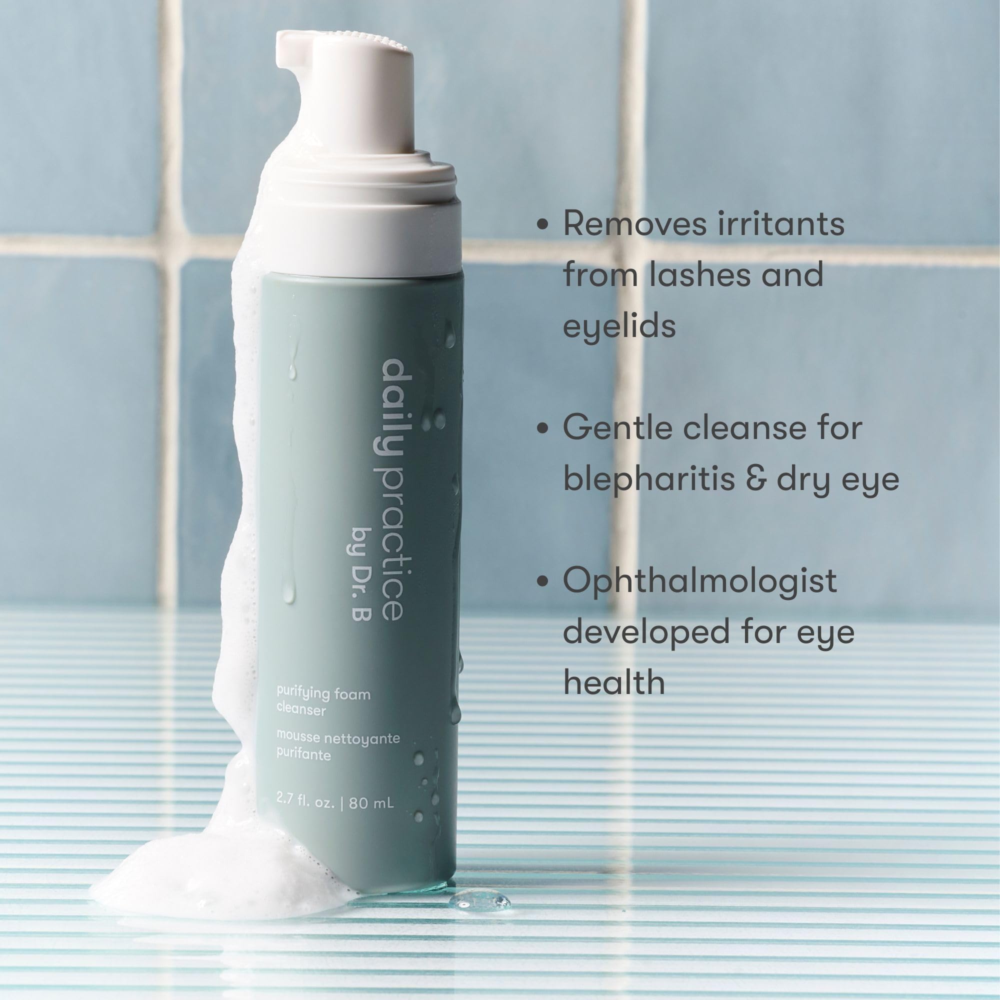Close-up of Daily Practice Dr. B Purifying Foam Cleanser foam around eyelids.