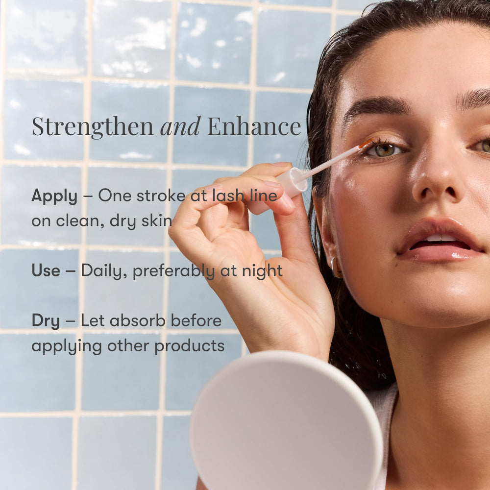 Close-up of applying Daily Practice Lash Serum near lashes.
