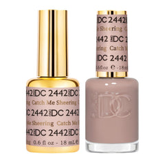 DAISY DND Catch Me Sheering bottle showcases sheer toasted mauve for customizable coverage; ideal for subtle nails.
