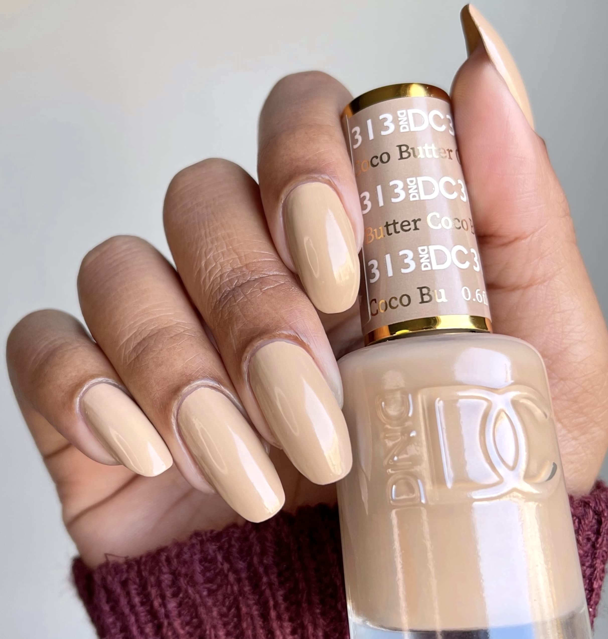 Daisy DND Coco Butter lacquer bottle matches the nude color for quick touch-ups