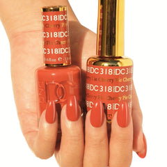Daisy DND gel polish in orange displays durable color and smooth finish.