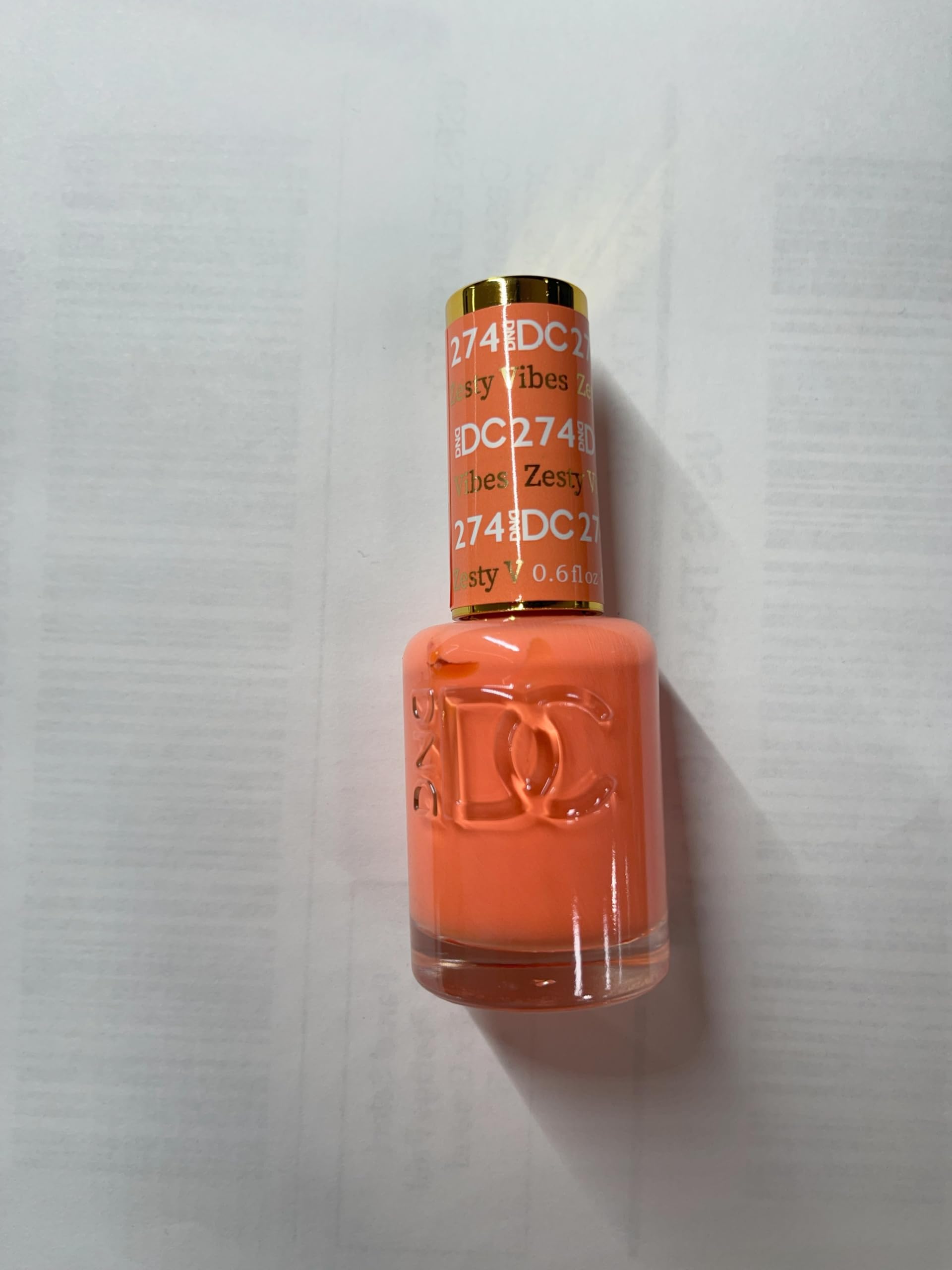 DAISY DND orange gel polish pigment close-up highlighting depth