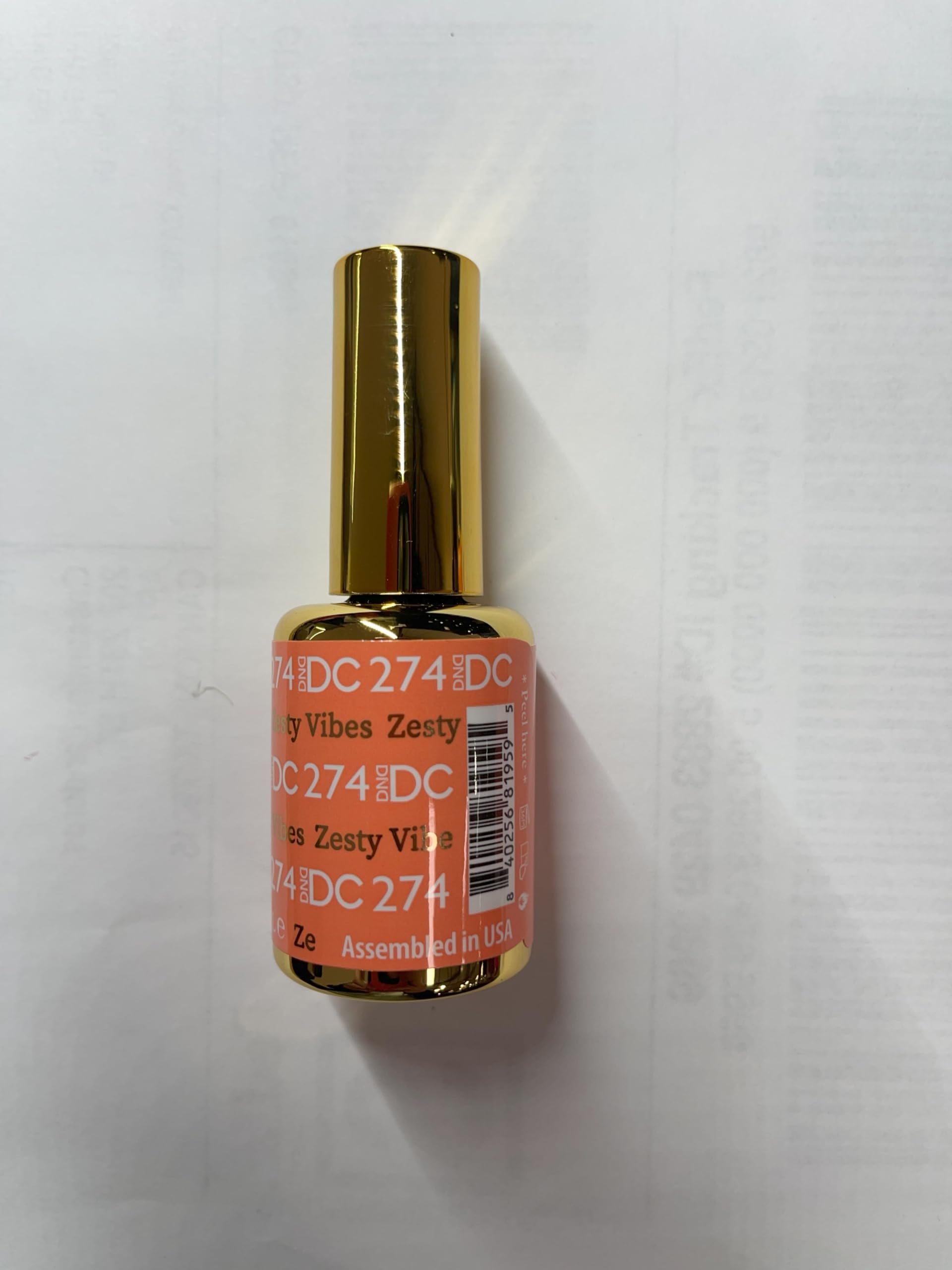 DAISY DND orange lacquer on glossy nails showing shiny finish