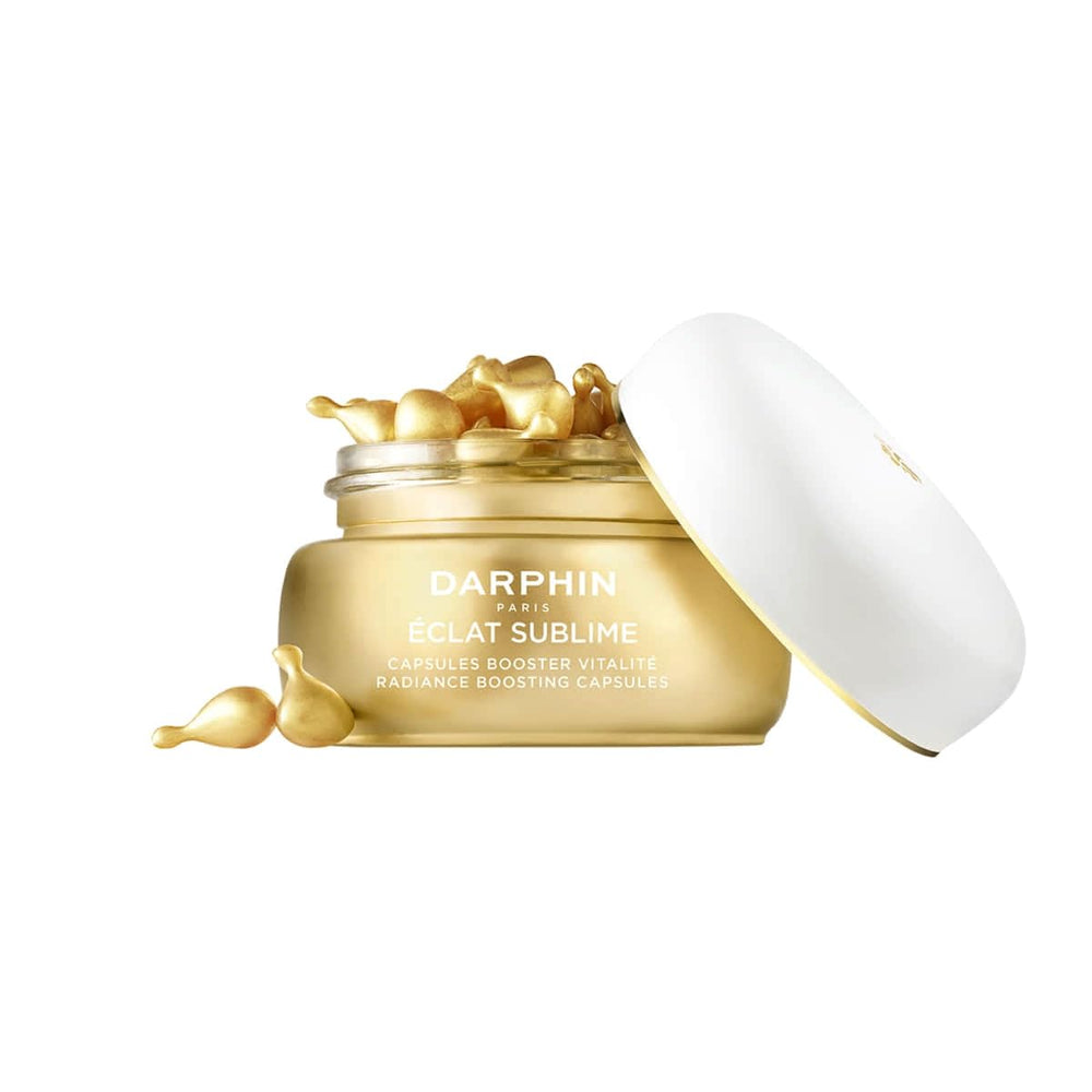 Close-up of Darphin Éclat Sublime capsules featuring Pro-Vitamin C and E.