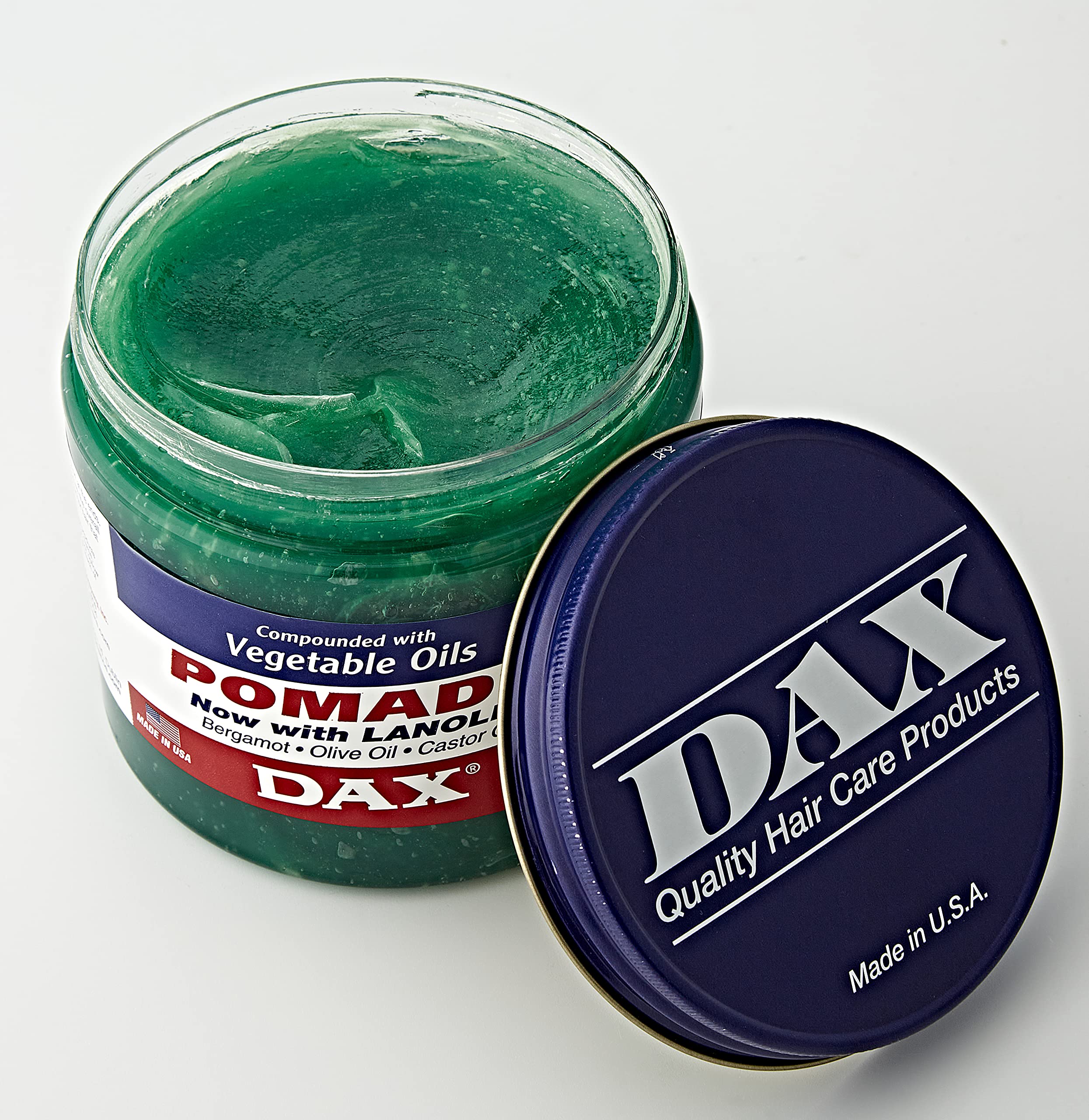 DAX Pomade 14 oz label closeup highlighting moisture-rich formula.