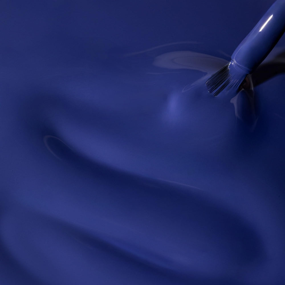 Dazzle Dry application brush with Base Camp lacquer on nails.