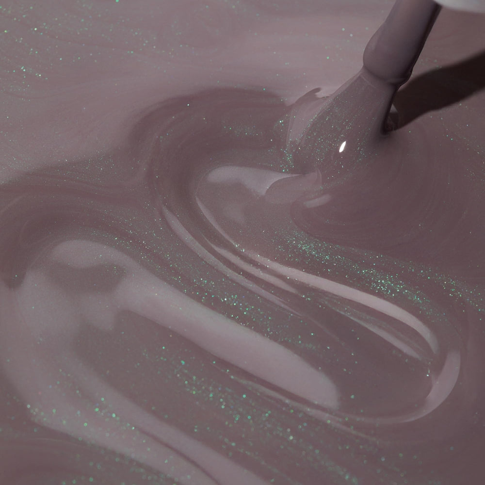 Dazzle Dry Lets Glow semi-sheer finish reveals purple taupe with green shimmer.