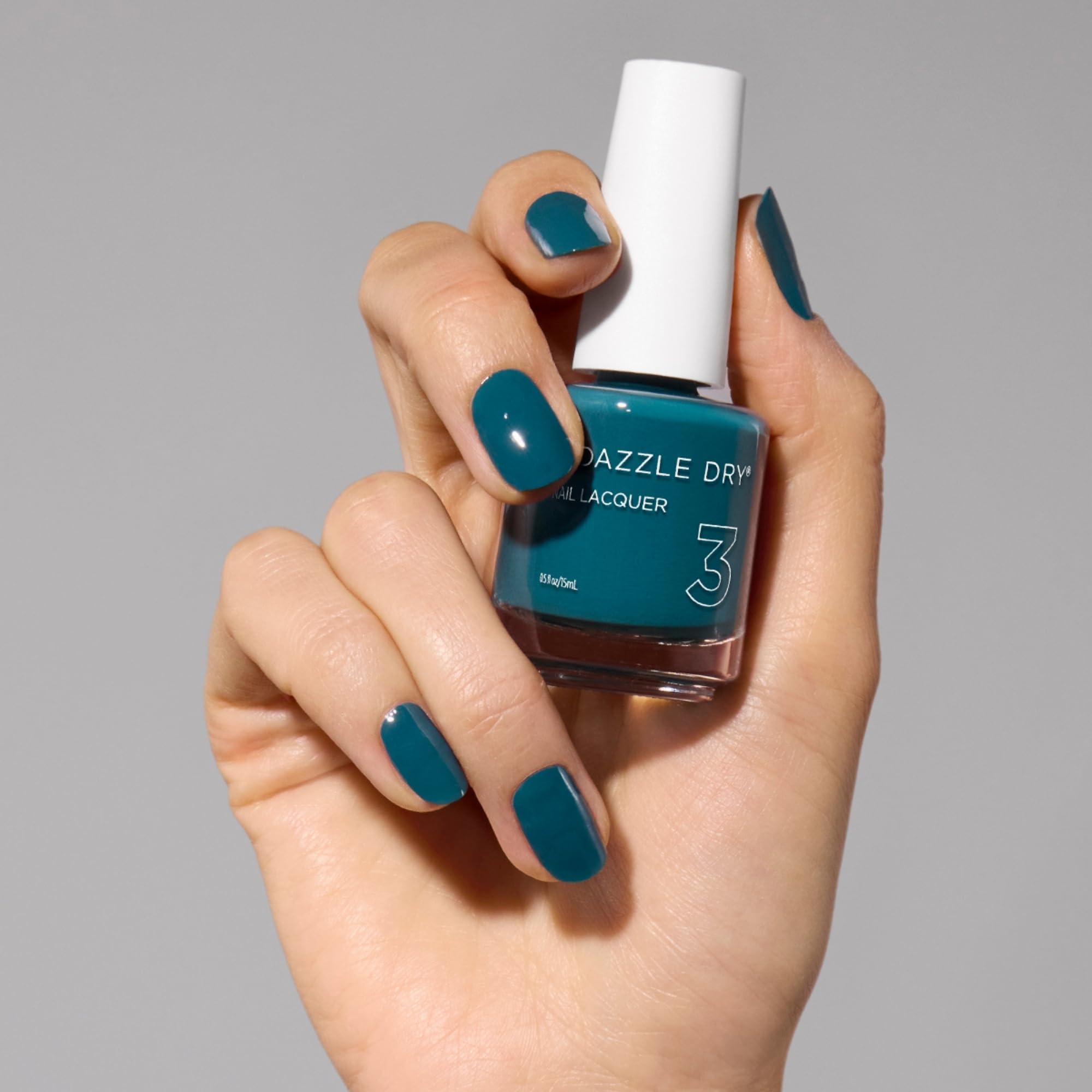 Dazzle Dry My Serenity full manicure on hand showcases vibrant teal tone.