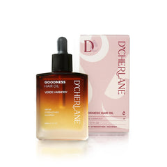 D'Cherlane Hair Growth Oil bottle close-up for nourishing scalp care.