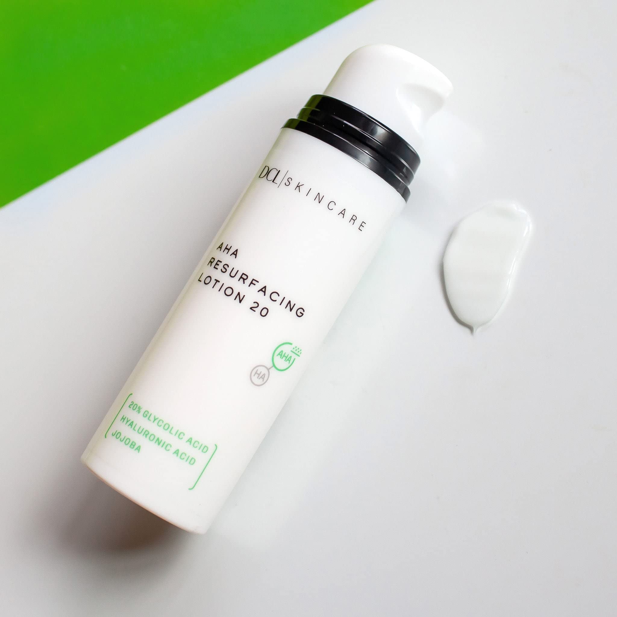 DCL AHA lotion pump in hand for simple nightly exfoliation routine.