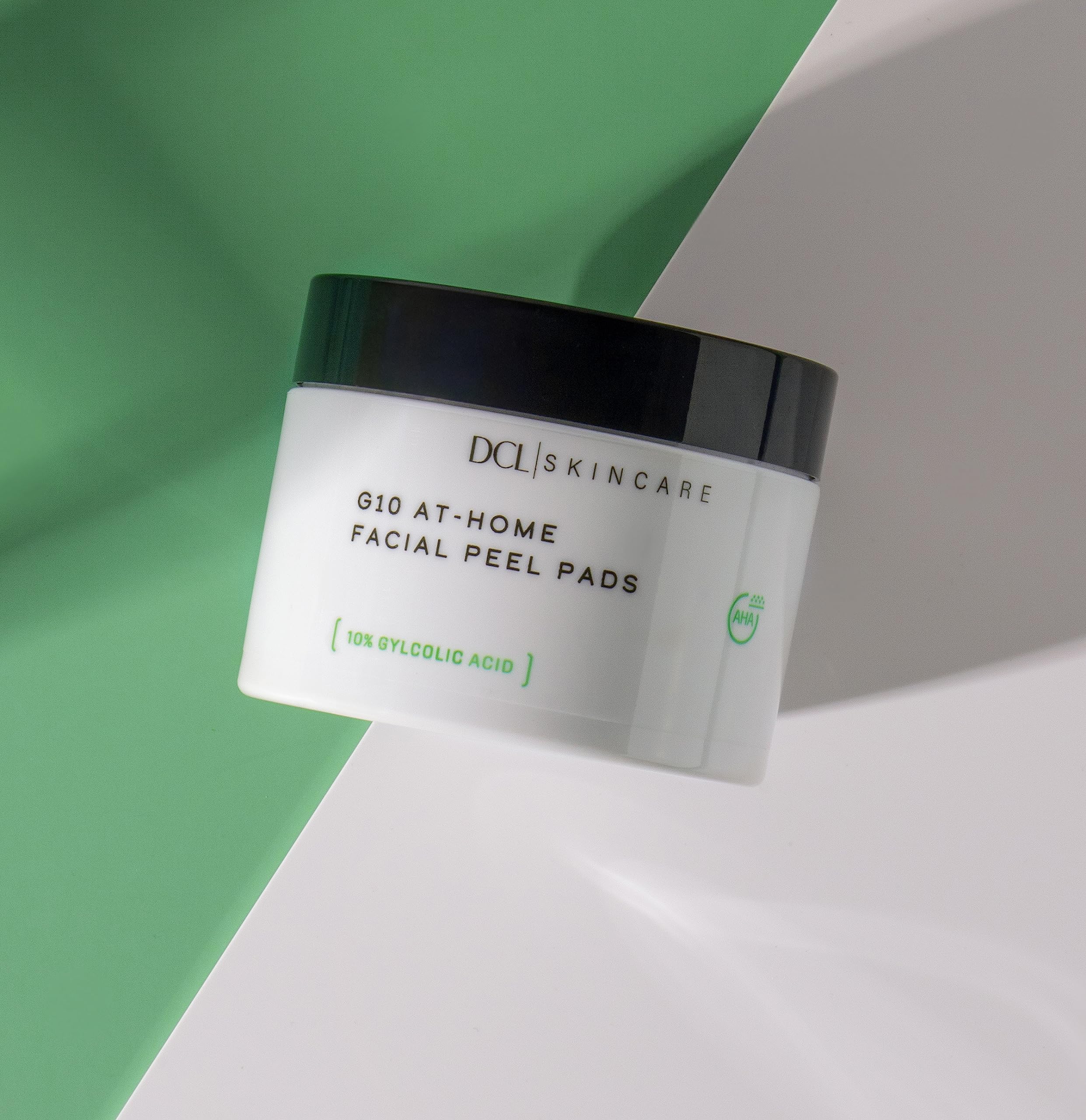 DCL G10 Radiance Peel pads in hand ready to decongest pores and target blemishes.