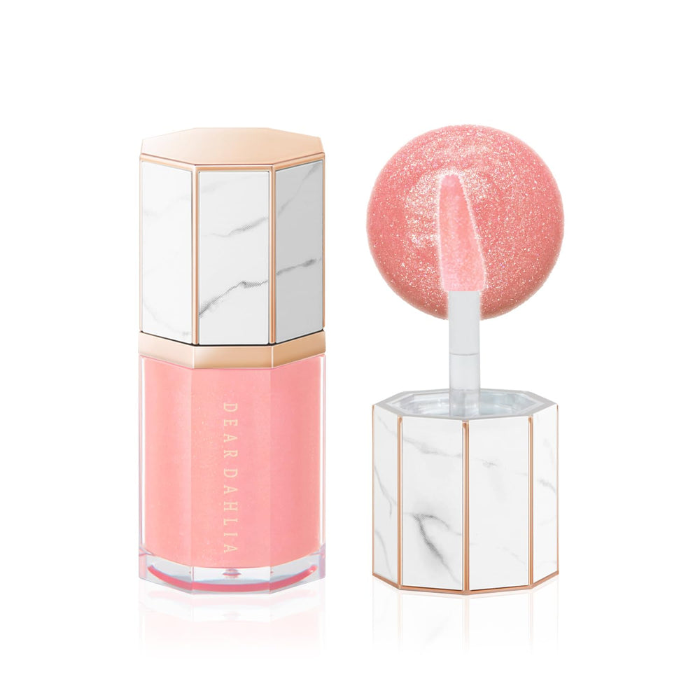 DEARDAHLIA Paradise Aurora Star Dust gloss adds radiant shine for a fuller-looking pout.