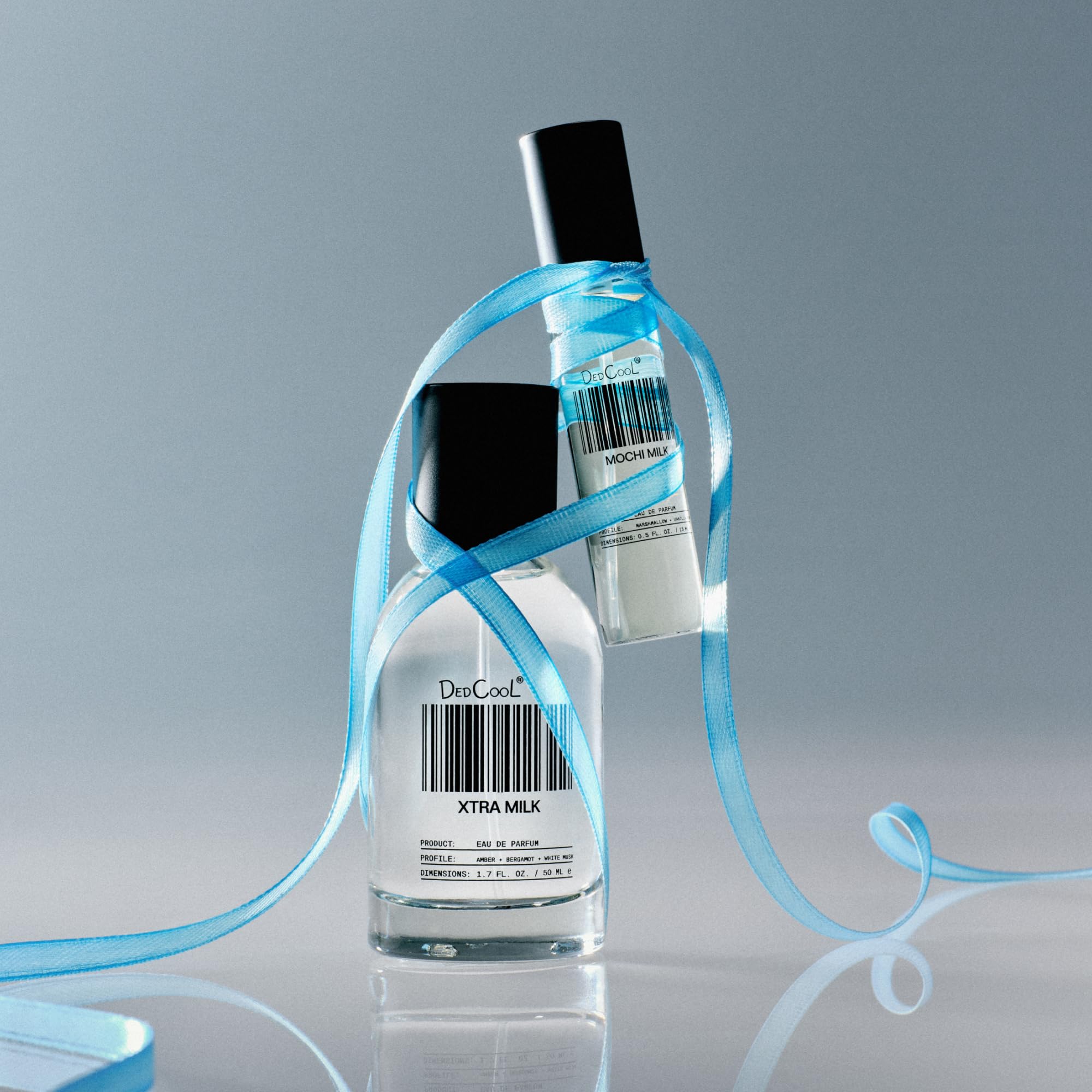 Close-up of DedCool Xtra Milk bottle highlighting premium packaging for luxury feel.