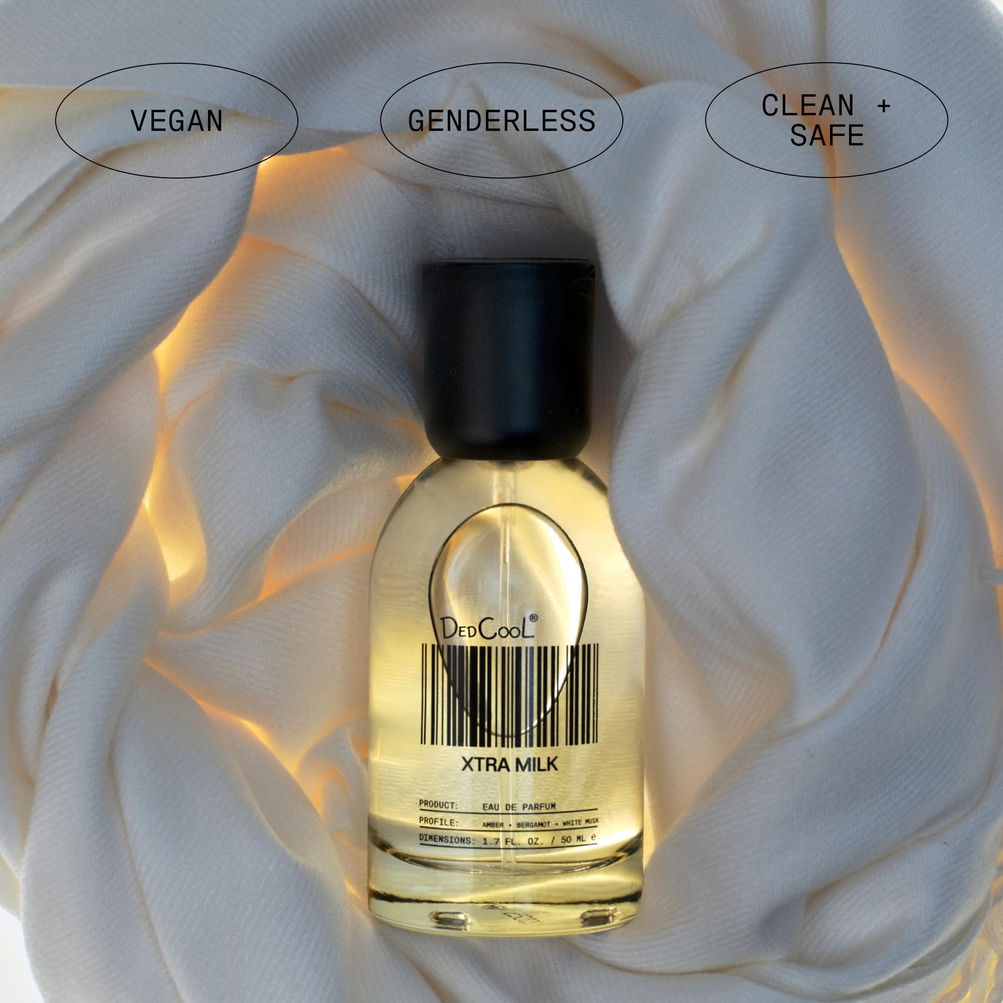 Hand applying DedCool Xtra Milk spray for a quick, refreshing scent.