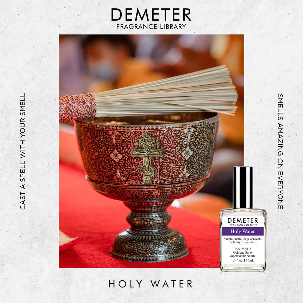 DEMETER Holy Water in hand, compact bottle for on-the-go scent.