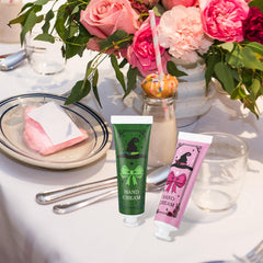 Demissle pink and green packaging close-up highlighting themed aesthetic.