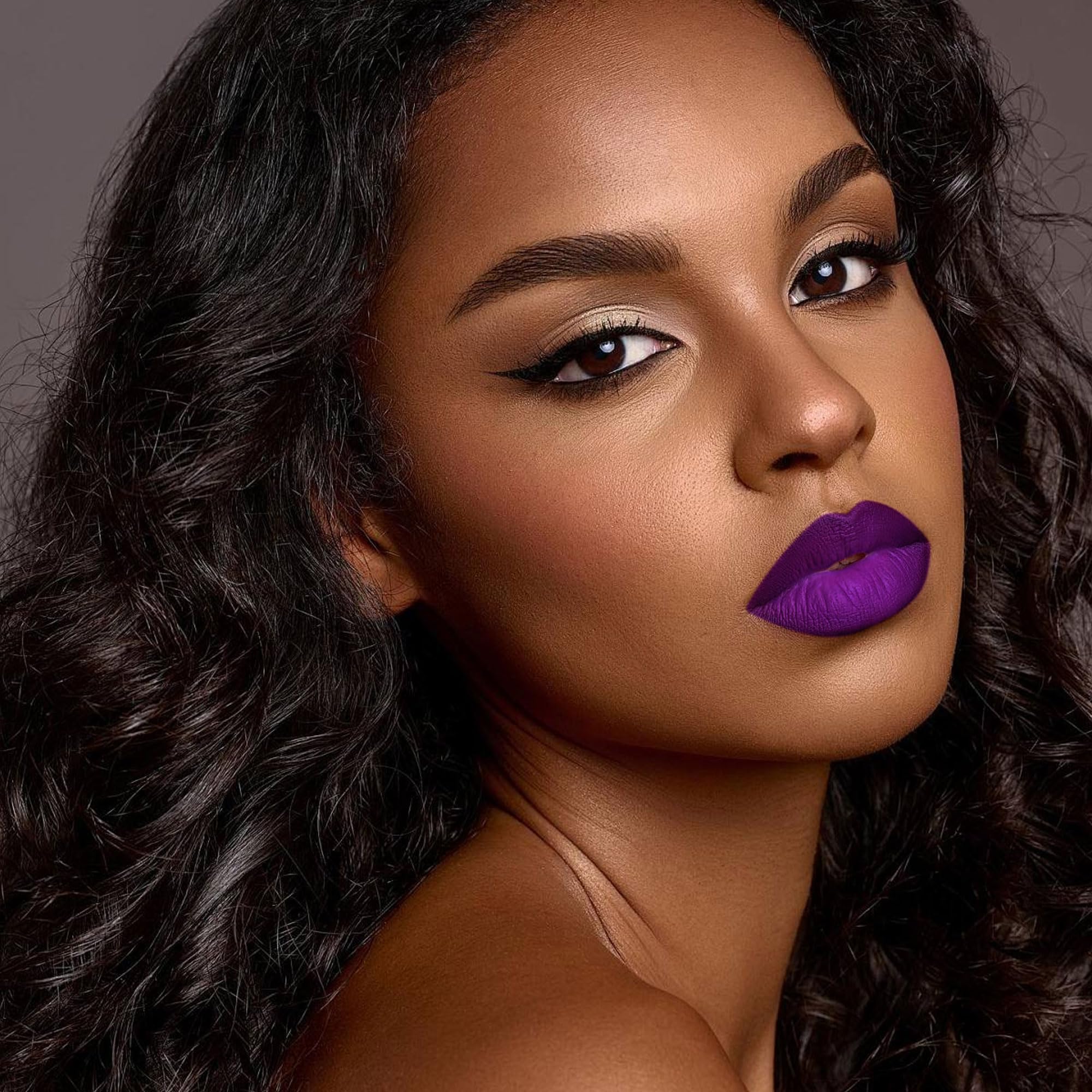 Depuplum Purple Crystal swatches reveal a bold purple shade on lips.