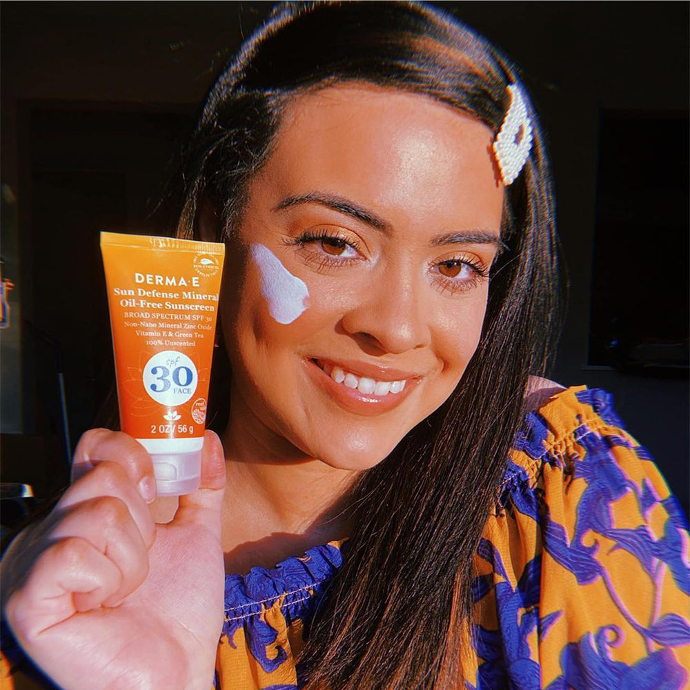 Derma E Sun Defense recyclable packaging in eco-friendly design.