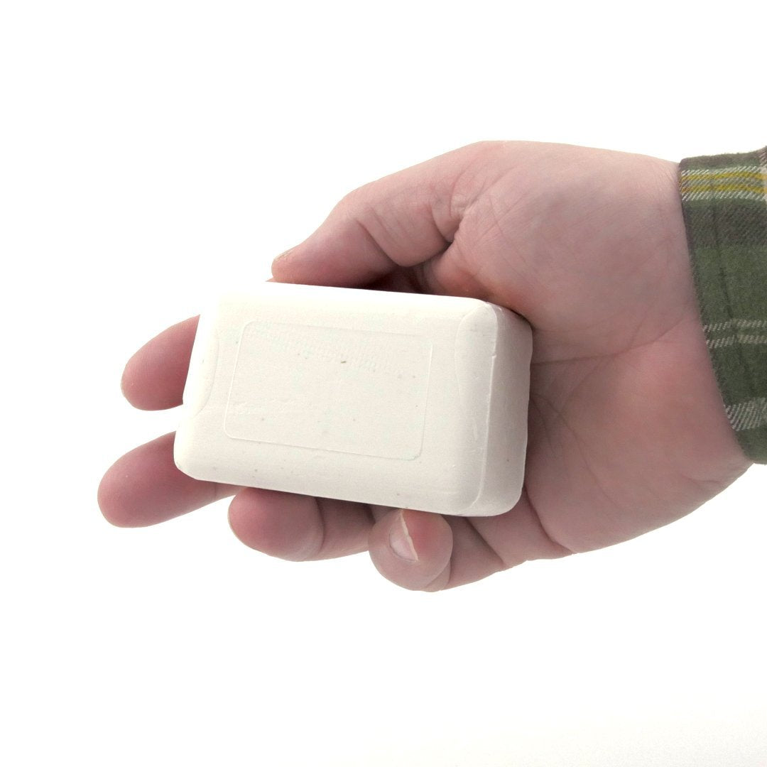 DermaHarmony Pyrithione Zinc soap bar closeup shows natural oils and oatmeal for soothing cleansing.