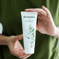 Close-up of Dermaka cream being applied to the skin for gentle absorption.