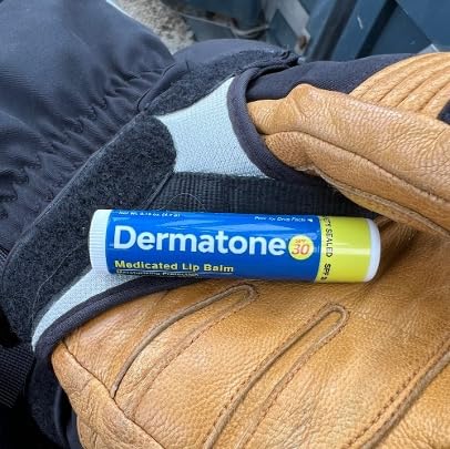 Dermatone SPF 30 lip balm resting in a windy landscape protects against chapping.