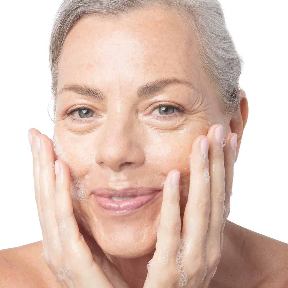Dermelect Rapid Repair Cleanser water rinse scene suggests easy removal of impurities