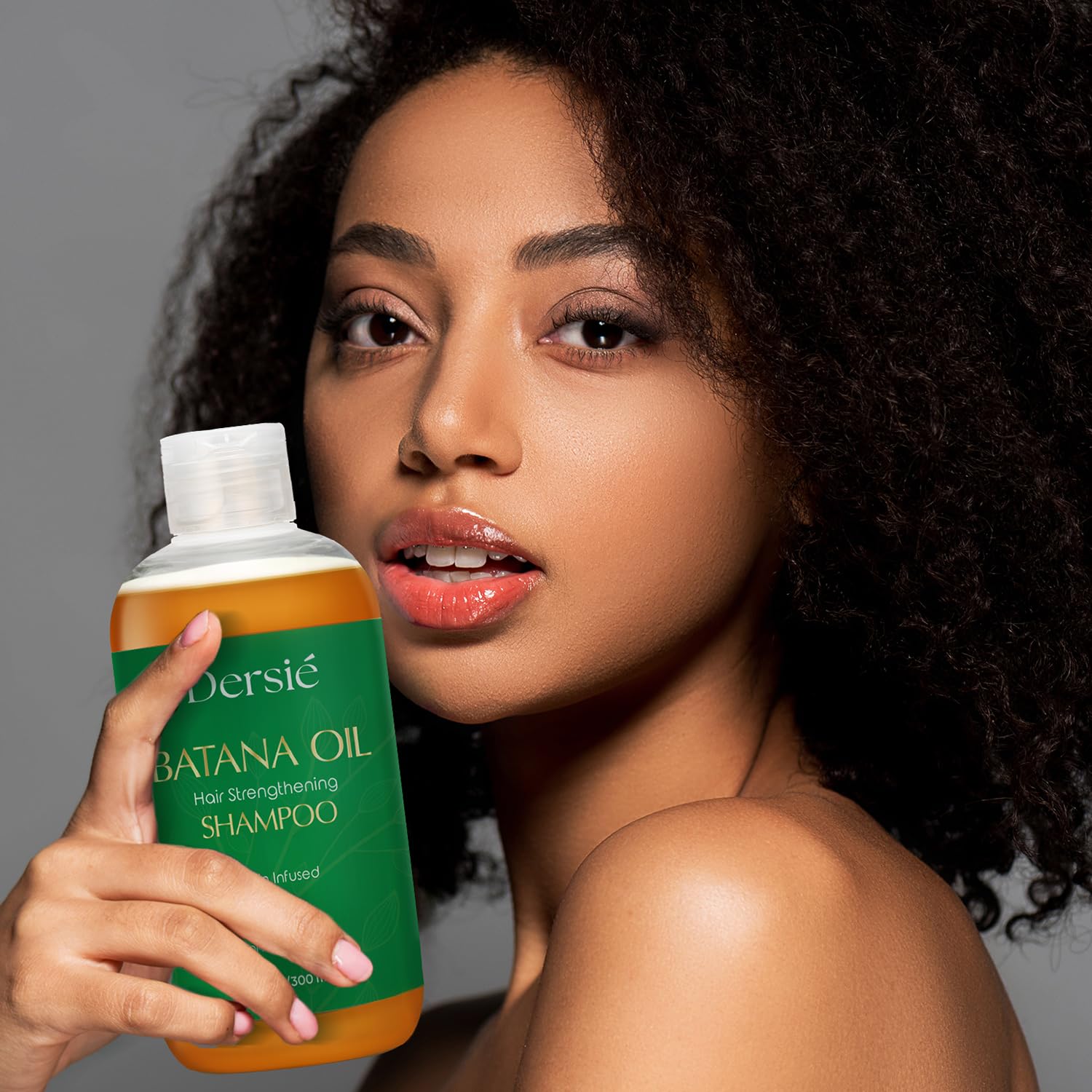 Dersie Batana Oil Shampoo on hair strands shows smooth shine