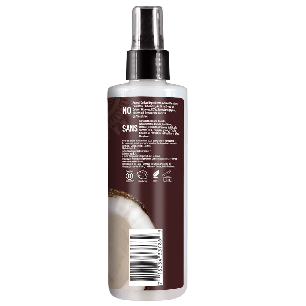 Desert Essence coconut hair defrizzer spray shown delivering frizz-free results.