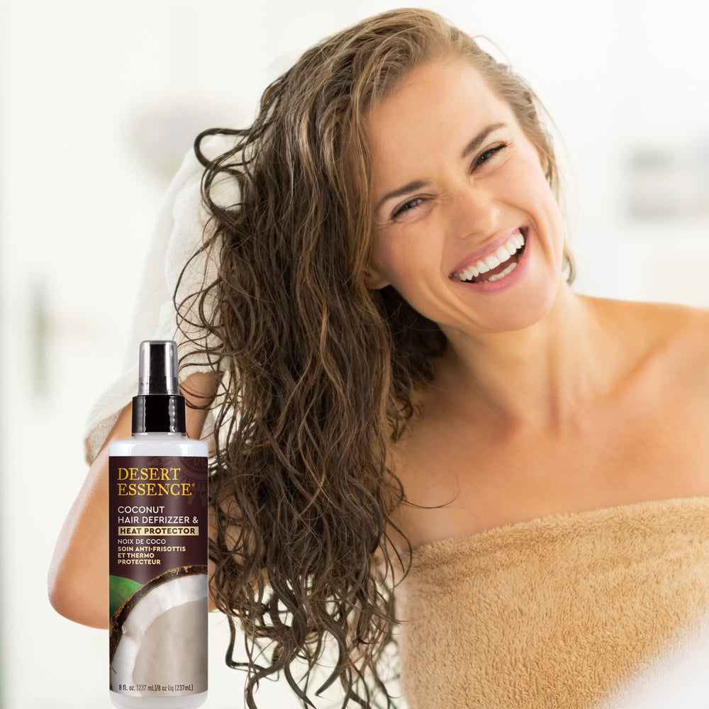 Desert Essence coconut defrizzer label emphasizing vegan and gluten-free benefits.