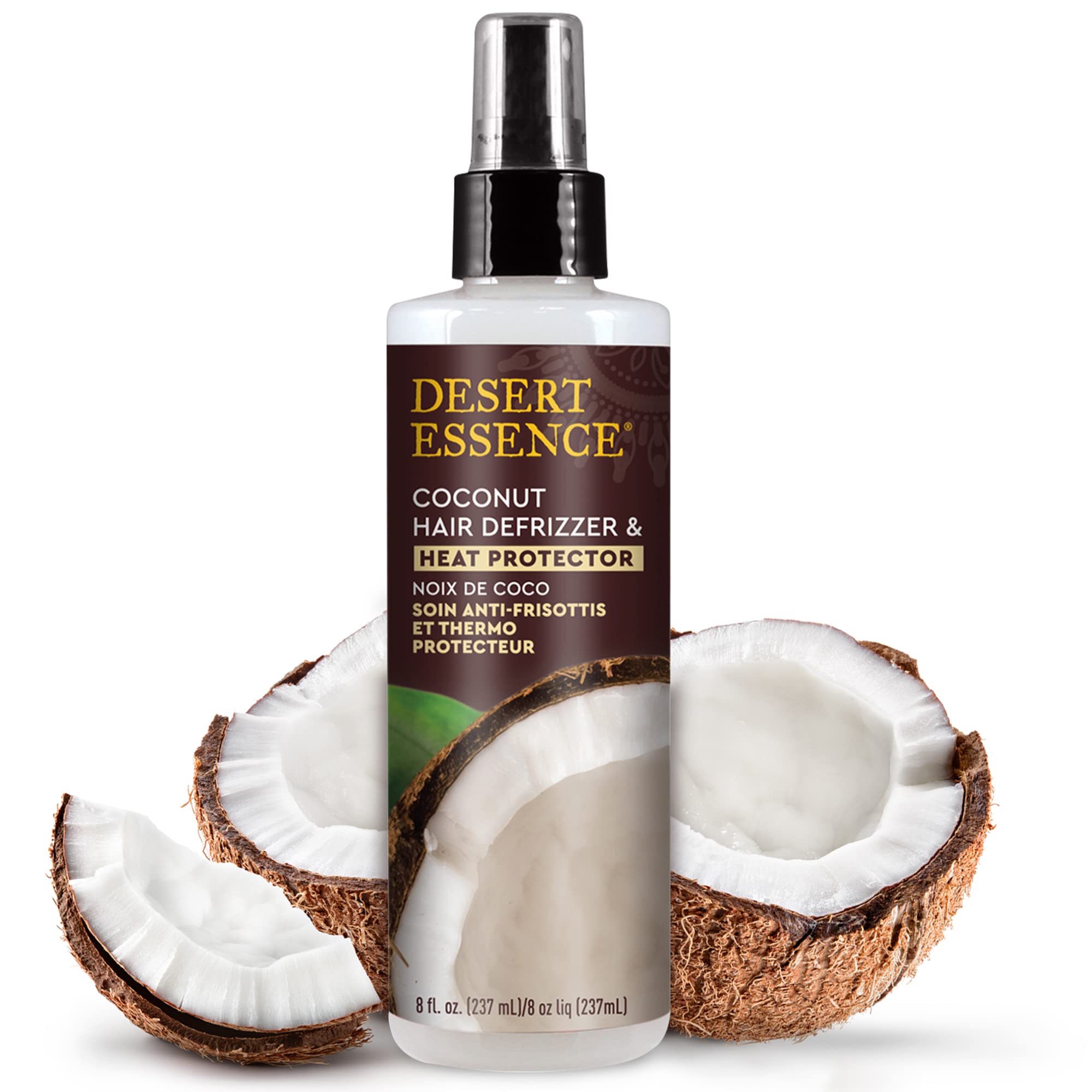 Desert Essence Coconut Defrizzer spray shown applying to damp hair for frizz control.