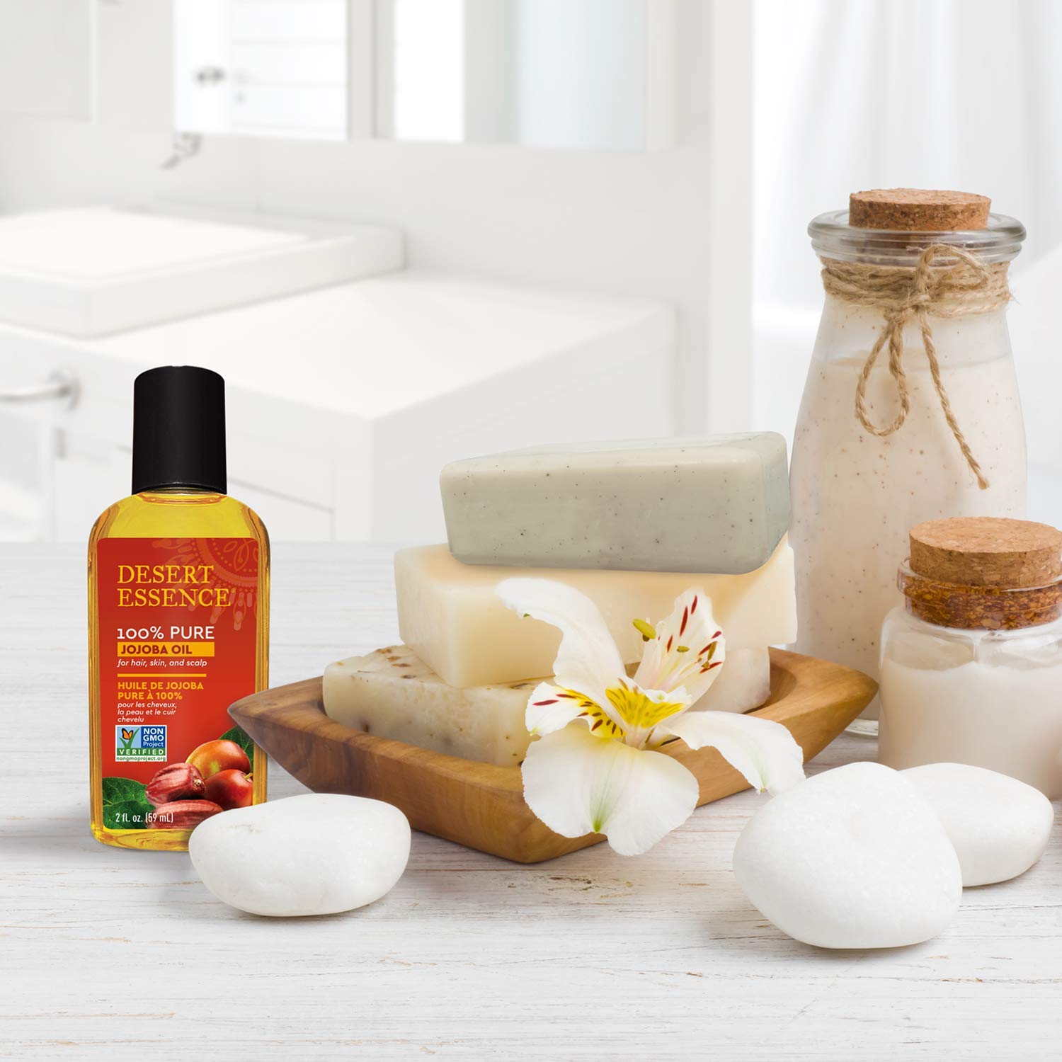 Desert Essence jojoba oil bottle on a stand signaling premium packaging.