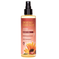 Desert Essence body oil spray applied to skin for quick absorption